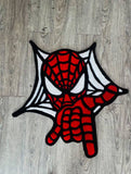 Spider-Man patch on a wooden surface