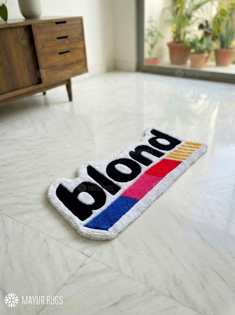 Colorful rug with 'blond' branding on a light-colored floor.