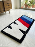 BMW IIM logo inspired hand-tufted wool rug with motorsport automotive design, premium custom area rug by Mayur Rugs