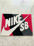 Nike SB logo on a rug with a geometric pattern