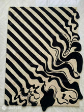 Melting liquid abstract hand-tufted wool rug with drip effect silhouette, premium custom area rug by Mayur Rugs