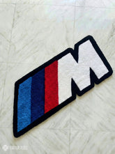 BMW IIM logo inspired hand-tufted wool rug with motorsport automotive design, premium custom area rug by Mayur Rugs