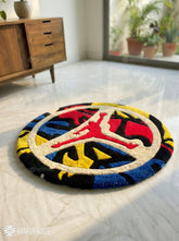Jumpman inspired round hand-tufted wool rug with bold basketball silhouette design, premium custom area rug by Mayur Rugs