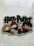 Harry Potter-themed rug with cartoon characters on a textured surface