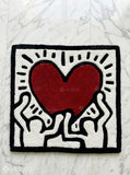 Keith Haring inspired abstract hand-tufted wool rug with pop-art street aesthetic design by Mayur Rugs