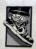High-top sneaker hand-tufted wool rug featuring monochrome streetwear-inspired footwear artwork by Mayur Rugs
