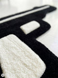 Pistol graphic hand-tufted wool rug with bold urban statement design, premium custom area rug by Mayur Rugs