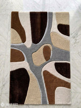 Earth tone abstract hand-tufted wool rug featuring organic modern shapes in brown, beige, ivory, and grey by Mayur Rugs
