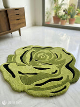 Sage green rose shaped hand-tufted wool rug with layered botanical floral detailing by Mayur Rugs