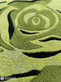 Sage green rose shaped hand-tufted wool rug with layered botanical floral detailing by Mayur Rugs