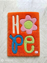 HOPE typography hand-tufted wool rug with minimalist inspirational aesthetic design by Mayur Rugs