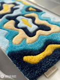 Ocean-inspired abstract hand-tufted keyboard rug featuring layered blue and cream flowing artwork for desk setups by Mayur Rugs
