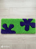 Retro splatter-inspired green and purple hand-tufted keyboard rug with Y2K abstract aesthetic by Mayur Rugs