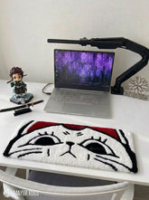 Sleepy cartoon cat face hand tufted keyboard rug with kawaii aesthetic by Mayur Rugs