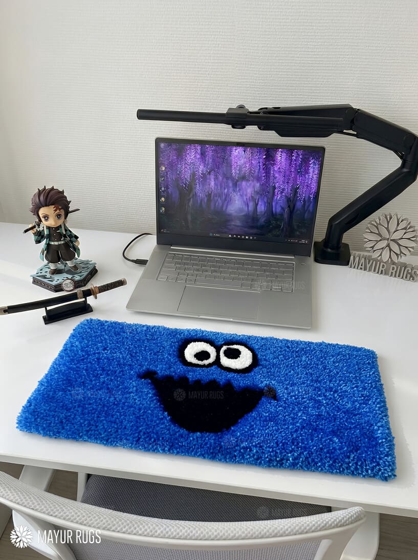 Blue monster-inspired hand-tufted keyboard rug with playful cartoon aesthetic by Mayur Rugs