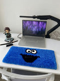 Blue monster-inspired hand-tufted keyboard rug with playful cartoon aesthetic by Mayur Rugs