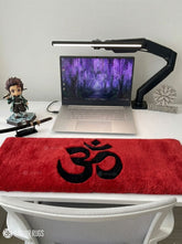Om symbol hand-tufted keyboard rug with spiritual meditation aesthetic by Mayur Rugs