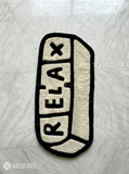 Relax pill-inspired hand-tufted wool rug with modern chill aesthetic and plush texture by Mayur Rugs