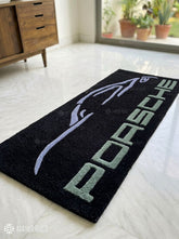 Porsche sports car silhouette hand-tufted wool rug with luxury automotive aesthetic by Mayur Rugs