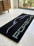 Porsche sports car silhouette hand-tufted wool rug with luxury automotive aesthetic by Mayur Rugs