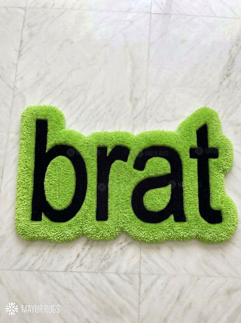 Lime green brat text hand-tufted wool rug featuring bold typography aesthetic by Mayur Rugs