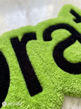 Lime green brat text hand-tufted wool rug featuring bold typography aesthetic by Mayur Rugs