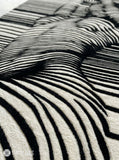 Abstract human illusion hand tufted wool rug featuring black and white optical art contour line design by Mayur Rugs