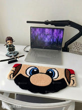 Mario inspired face hand tufted keyboard rug featuring iconic gaming character artwork by Mayur Rugs