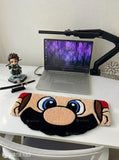 Mario inspired face hand tufted keyboard rug featuring iconic gaming character artwork by Mayur Rugs