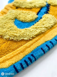 3D sneaker hand tufted wool rug featuring streetwear inspired footwear artwork by Mayur Rugs