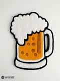 Beer mug hand tufted wool rug featuring frothy beer glass artwork by Mayur Rugs