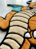 Pokemon Dragonite inspired hand tufted area rug with orange dragon character design handmade by Mayur Rugs