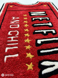 Netflix and Chill inspired hand tufted wool rug featuring movie ticket artwork by Mayur Rugs