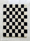 Black and white checkerboard hand tufted wool area rug featuring a classic geometric checkered pattern by Mayur Rugs.