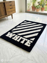 White stripe graphic hand tufted wool rug featuring bold monochrome geometric artwork by Mayur Rugs.