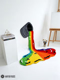 Rainbow paint spill hand tufted wool wall art rug featuring a colorful tipped paint bucket and flowing rainbow design by Mayur Rugs.