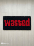 Wasted GTA inspired hand tufted keyboard rug featuring iconic gaming typography by Mayur Rugs.