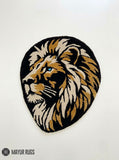 Lion head hand-tufted custom rug featuring a detailed golden, cream, and black lion portrait, handmade from premium New Zealand wool by Mayur Rugs.
