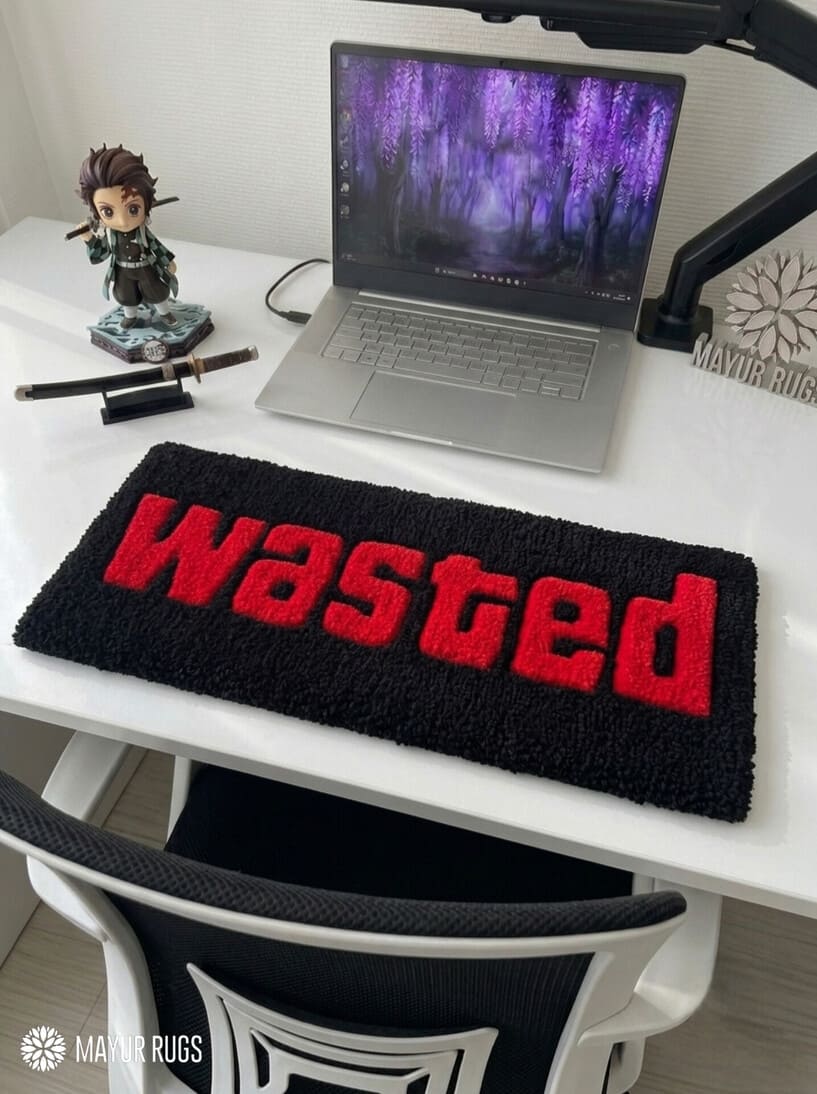 Wasted GTA inspired hand tufted keyboard rug featuring iconic gaming typography by Mayur Rugs.