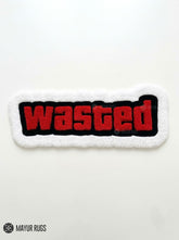 Wasted hand-tufted statement rug handmade in India by Mayur Rugs featuring bold gaming-inspired typography in red, black, and white.