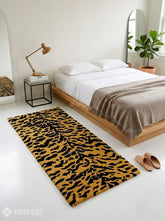 Tiger print hand-tufted runner rug featuring a bold black and golden stripe pattern, handmade from premium New Zealand wool by Mayur Rugs.