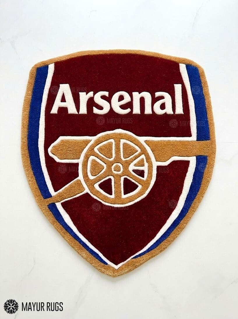 Arsenal hand-tufted custom rug featuring the Arsenal football crest, cannon design, red and blue colors, handmade from premium New Zealand wool by Mayur Rugs.