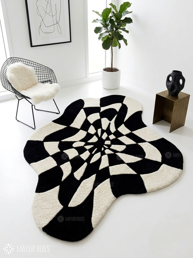 Black and white optical illusion hand-tufted wool rug featuring a distorted 3D geometric vortex pattern and modern op-art design by Mayur Rugs.