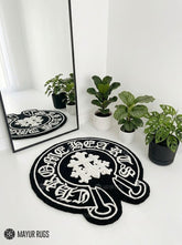 Chrome Hearts inspired gothic 3D hand-tufted custom wool rug featuring Old English lettering, gothic cross artwork, and black and white streetwear styling by Mayur Rugs.