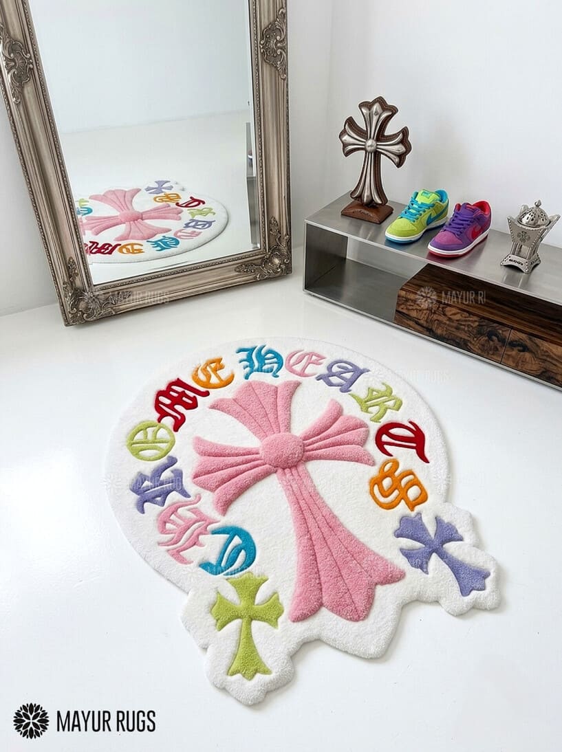 Chrome Hearts inspired colorful cross hand-tufted wool rug featuring a large pink gothic cross with multicolored cross motifs and ornate lettering by Mayur Rugs.