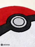 Poké Ball inspired hand-tufted custom wool rug featuring the iconic red, white, black, and grey Pokémon-inspired design by Mayur Rugs.