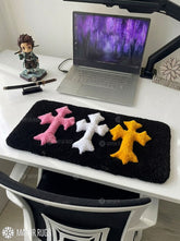 Chrome Hearts inspired cross keyboard rug featuring raised pink, white, and yellow gothic crosses on a black hand-tufted wool desk rug by Mayur Rugs.