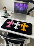 Chrome Hearts inspired cross keyboard rug featuring raised pink, white, and yellow gothic crosses on a black hand-tufted wool desk rug by Mayur Rugs.