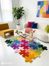 Colorful jigsaw puzzle hand-tufted area rug featuring interlocking puzzle pieces in yellow, orange, pink, red, purple, blue, teal, green, and black by Mayur Rugs.