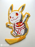 Pikachu skeleton inspired 3D hand-tufted custom Pokémon rug featuring a yellow Pikachu-inspired character with white and grey skeleton detailing, red accents, pointed ears, and lightning-bolt tail by Mayur Rugs.